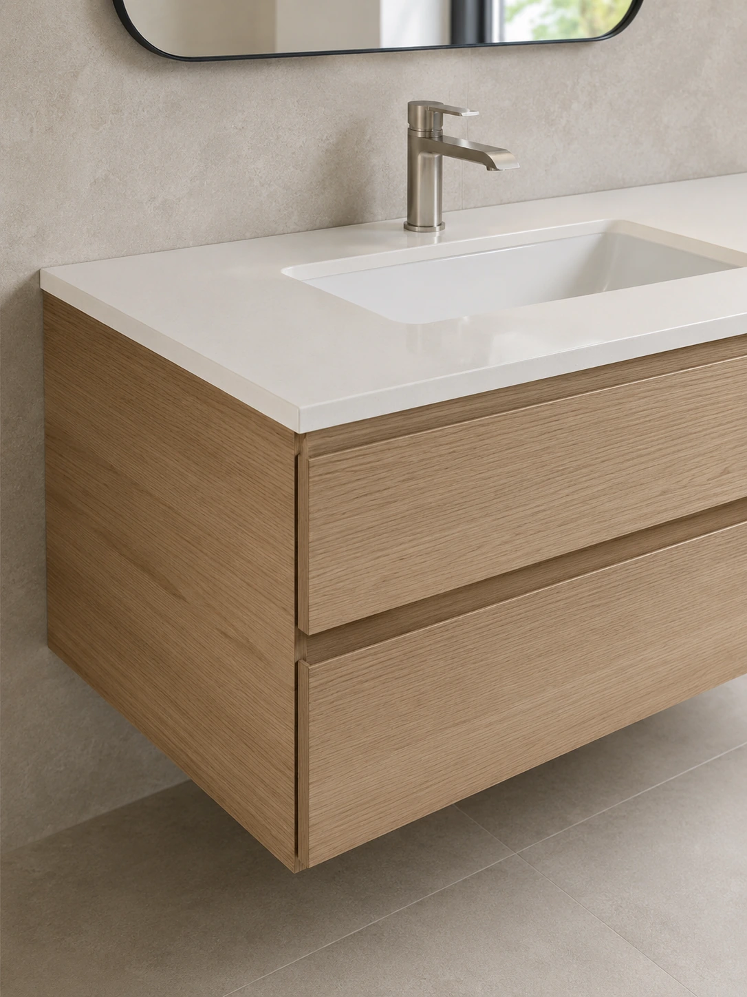 White rectangular basin set into a wood floating vanity