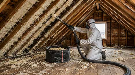 Loft spray foam removal service carried out by a trained technician in a residential attic