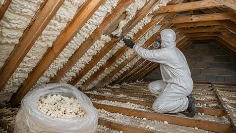 Professional spray foam insulation removal from a residential loft using specialist extraction equipment