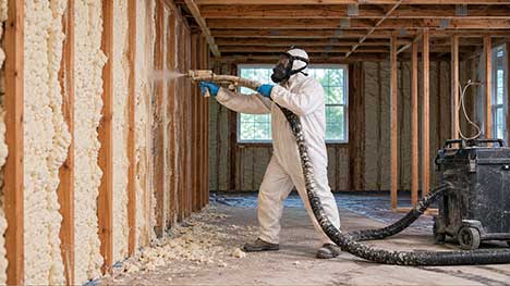 Mechanical spray foam extraction using industrial vacuum equipment inside a residential loft