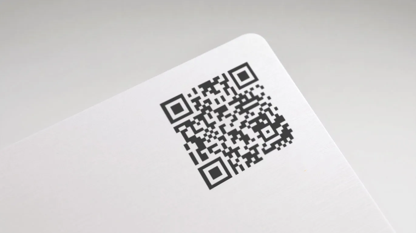 Paper business card corner with QR code