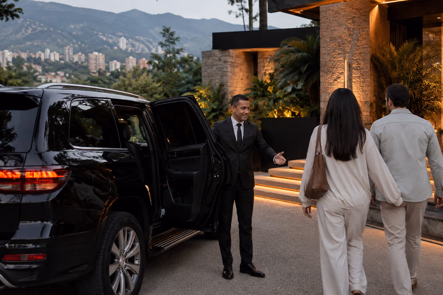 Driver assisting guests with luggage before a private transfer