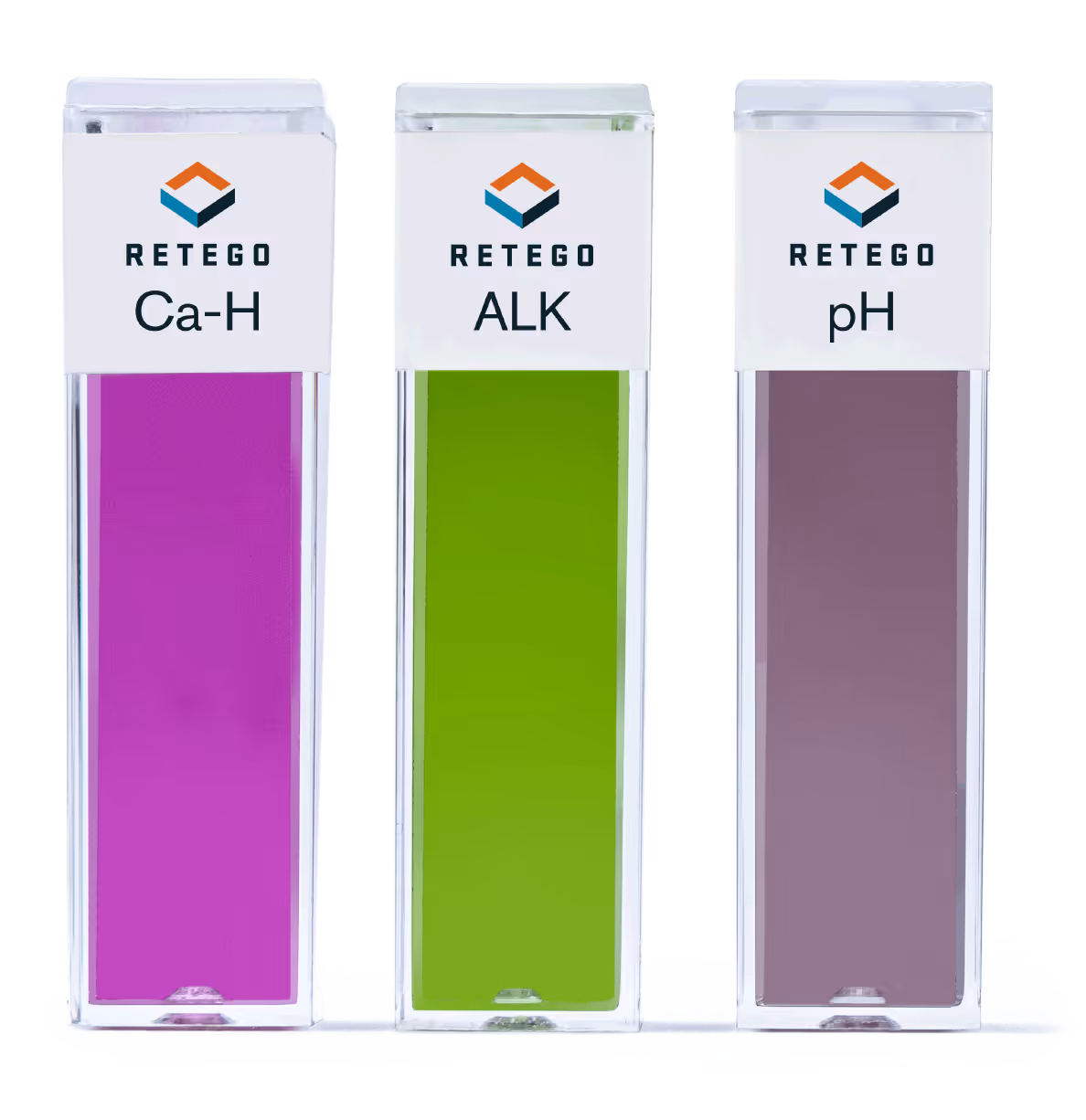 Three vertical rectangular test cuvettes labeled Ca-H, ALK, and pH with purple, green, and brown liquids respectively.