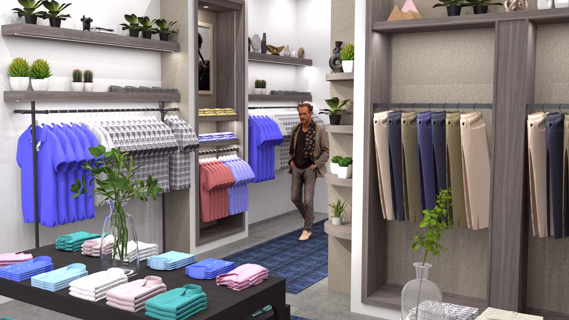 Inside a modern clothing store with folded shirts and hanging pants.