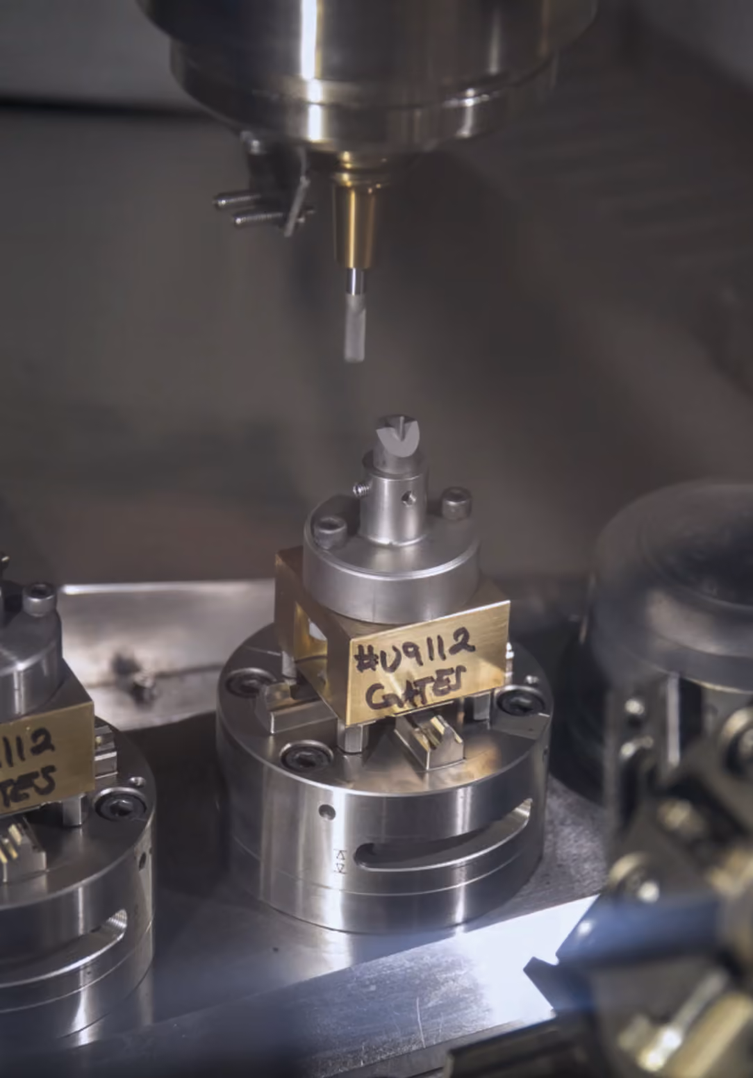 Close-up of a rotary grinding wheel cutting metal parts with sparks flying