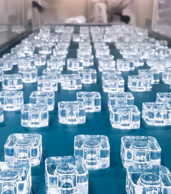Clear molded parts moving along a production conveyor