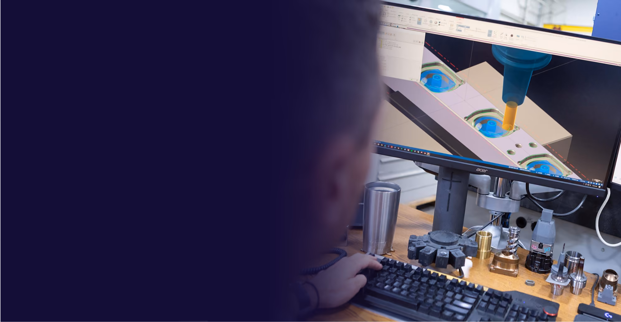 Engineer monitoring a CNC machining process on a computer screen