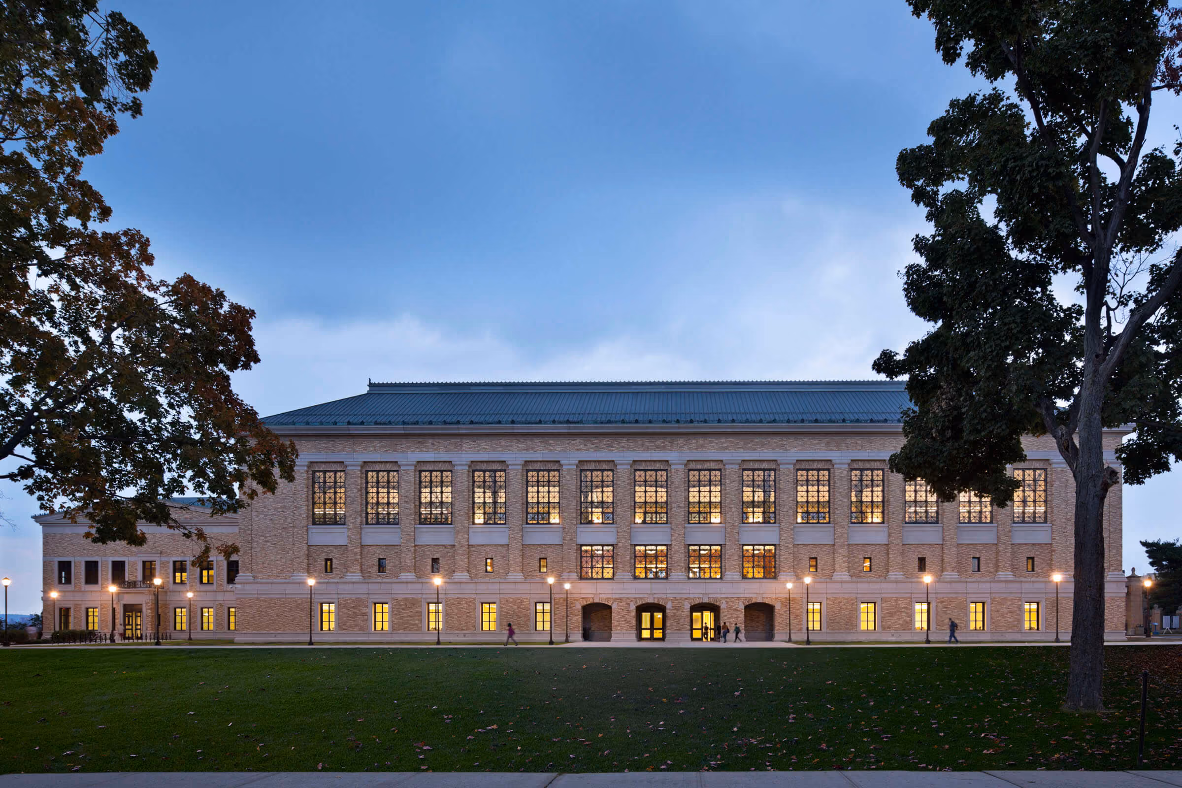 Bronx Community College campus building lit at dusk