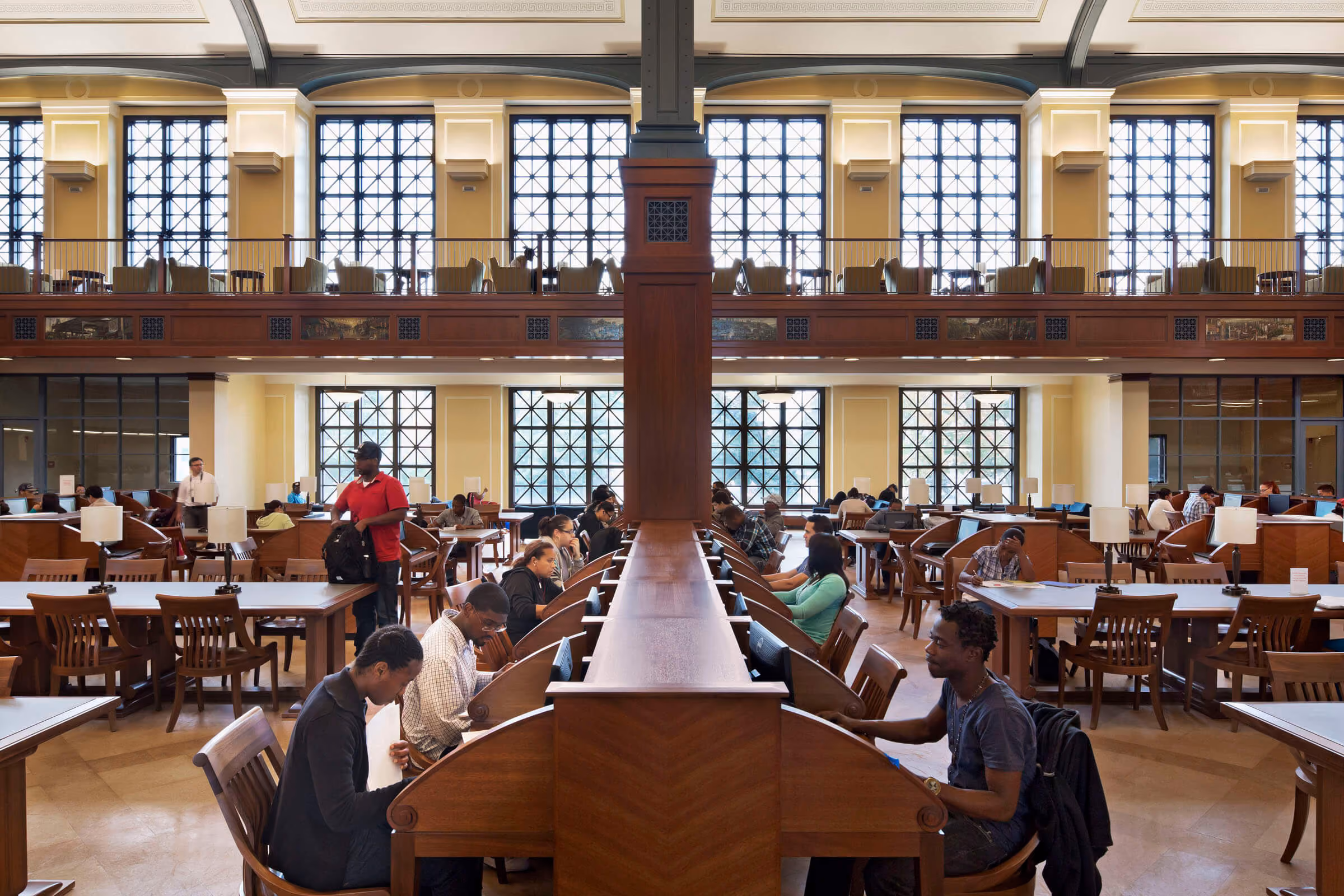 Students working in the Bronx Community College library reading room