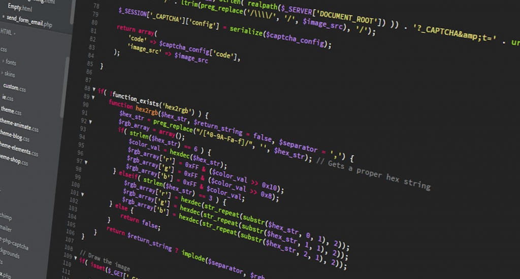 Decorative photograph of a code editor showing several screens of PHP source.