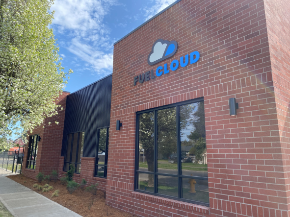 Front of brick building HQ, showing the FuelCloud logo on  