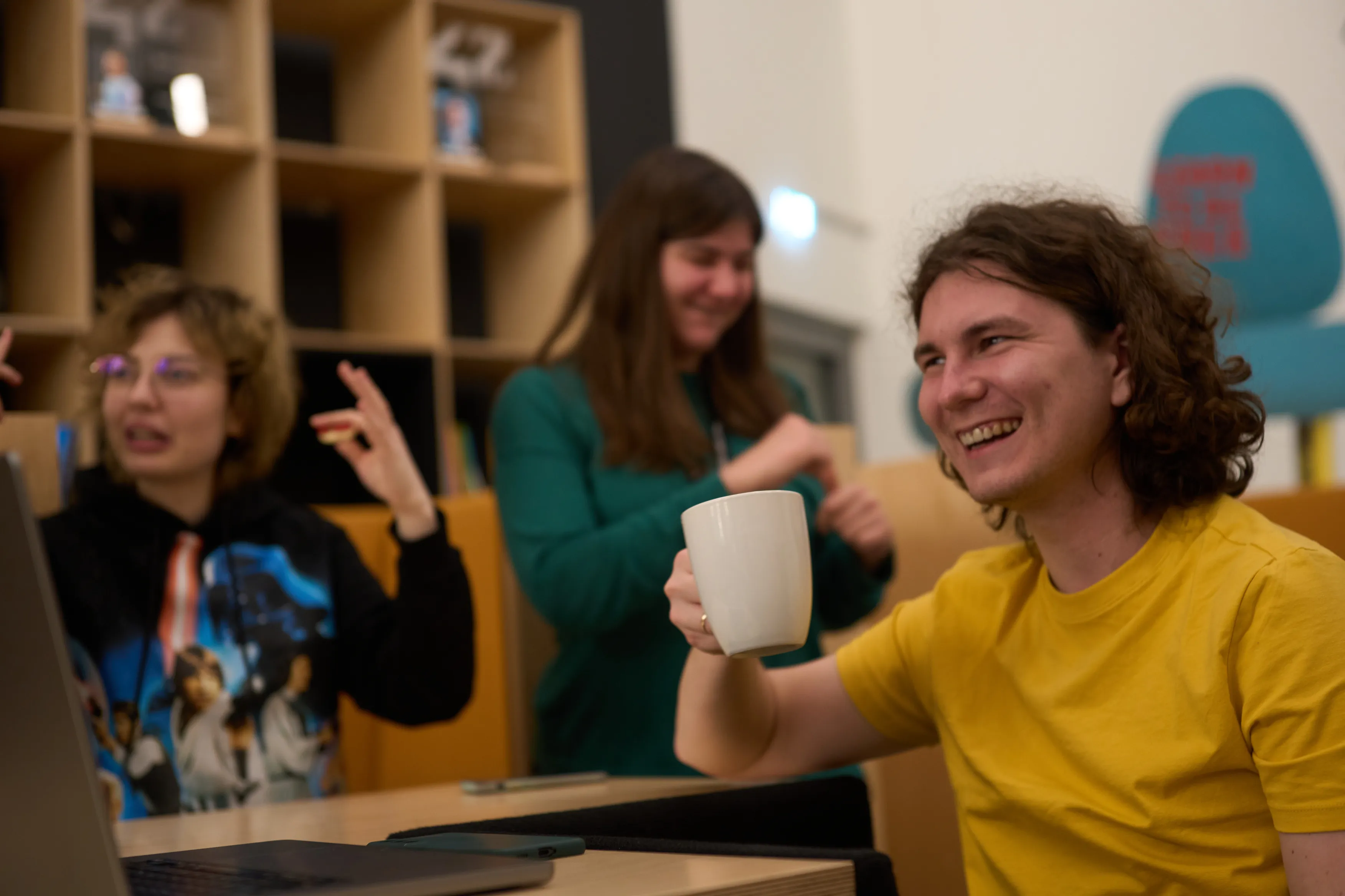 Students laughing over coffee
