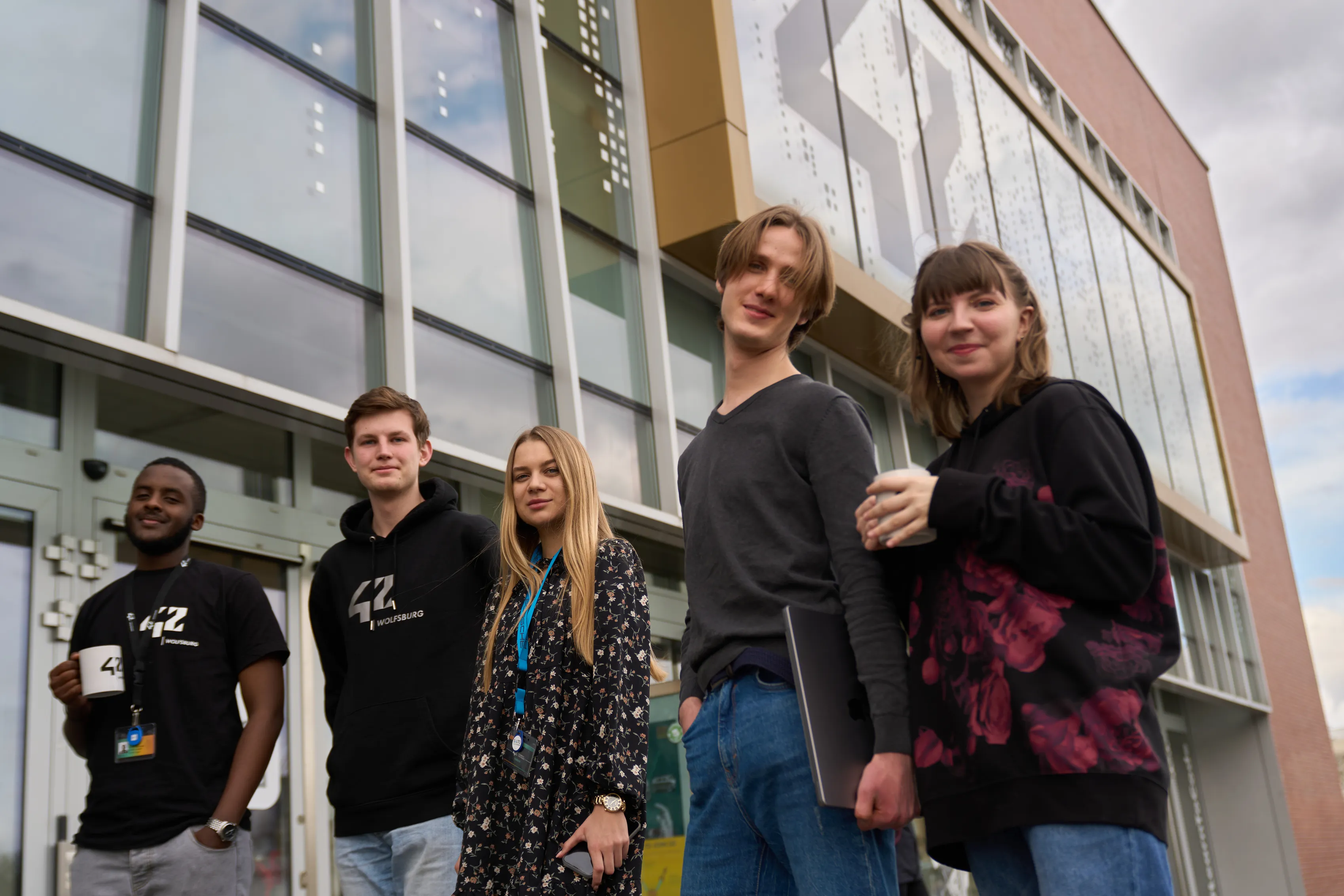 Five 42 Wolfsburg students outside the campus