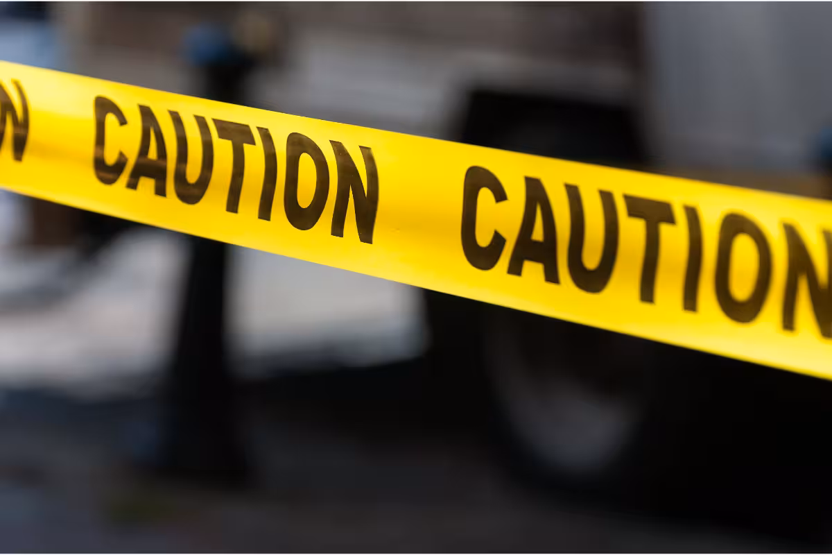 Caution tape around an accident.