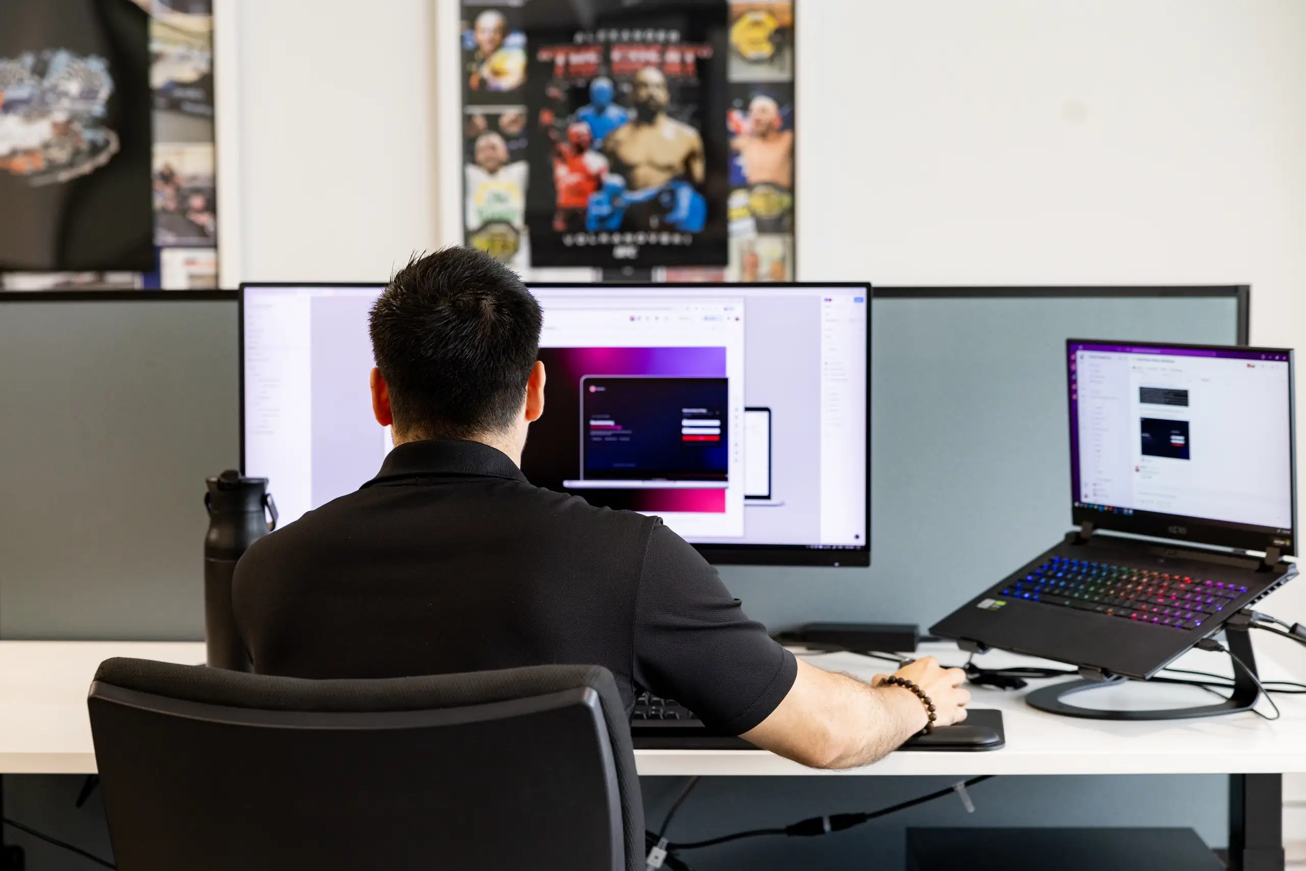 A Devika designer working at a studio desk