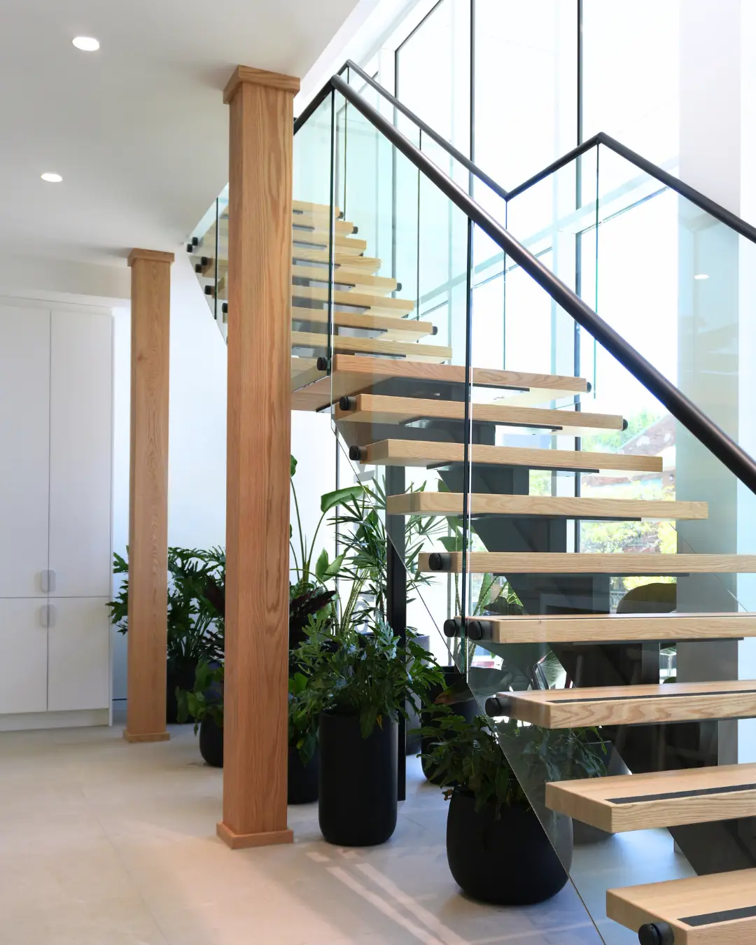 Timber and glass staircase inside Devika's Wollongong studio