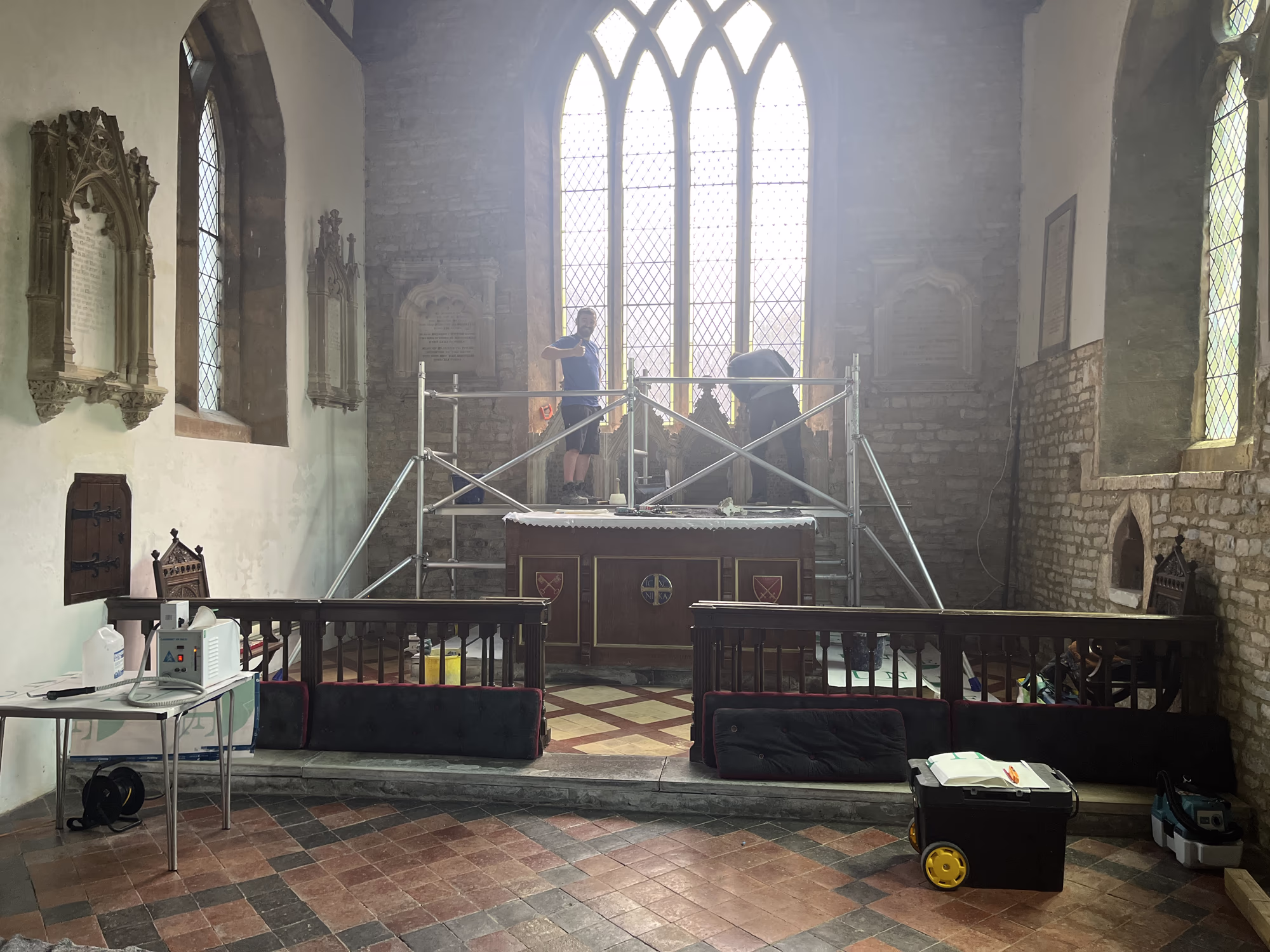 Reredos being carefully dismantled during conservation
