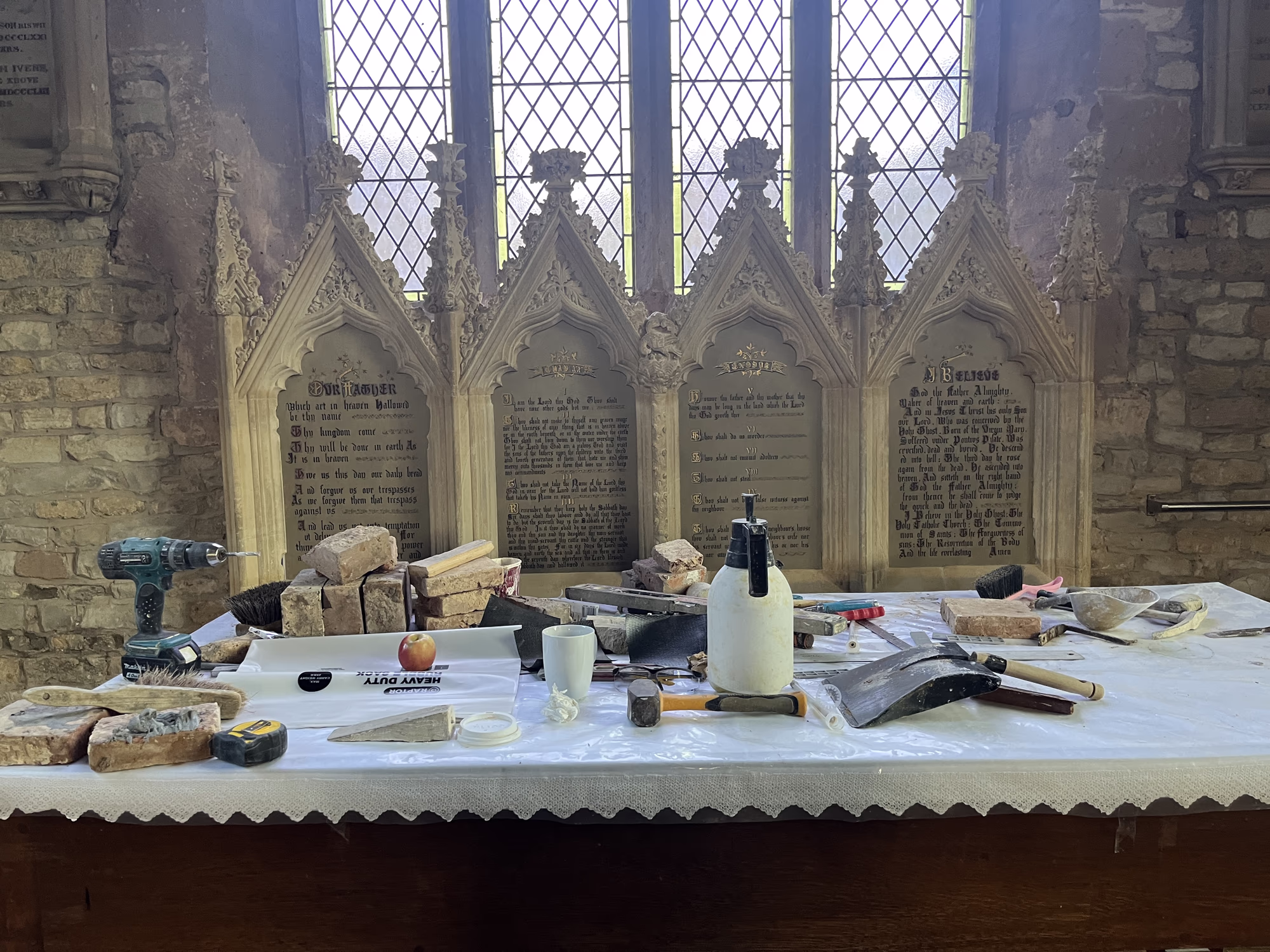 Reredos being reassembled following conservation work