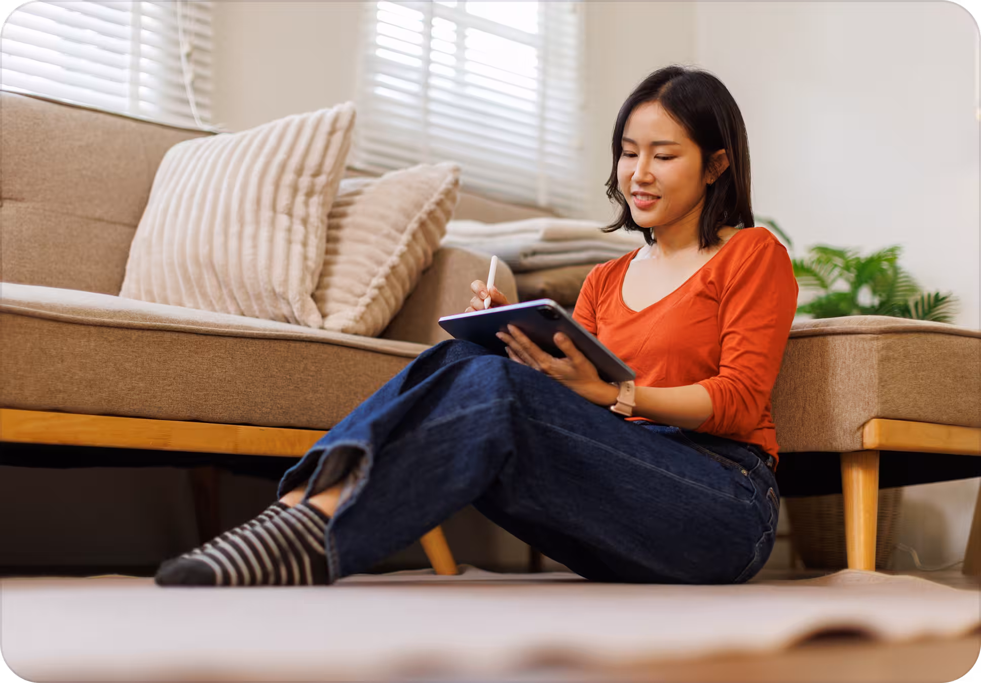 Woman managing her monthly instalments on a tablet at home