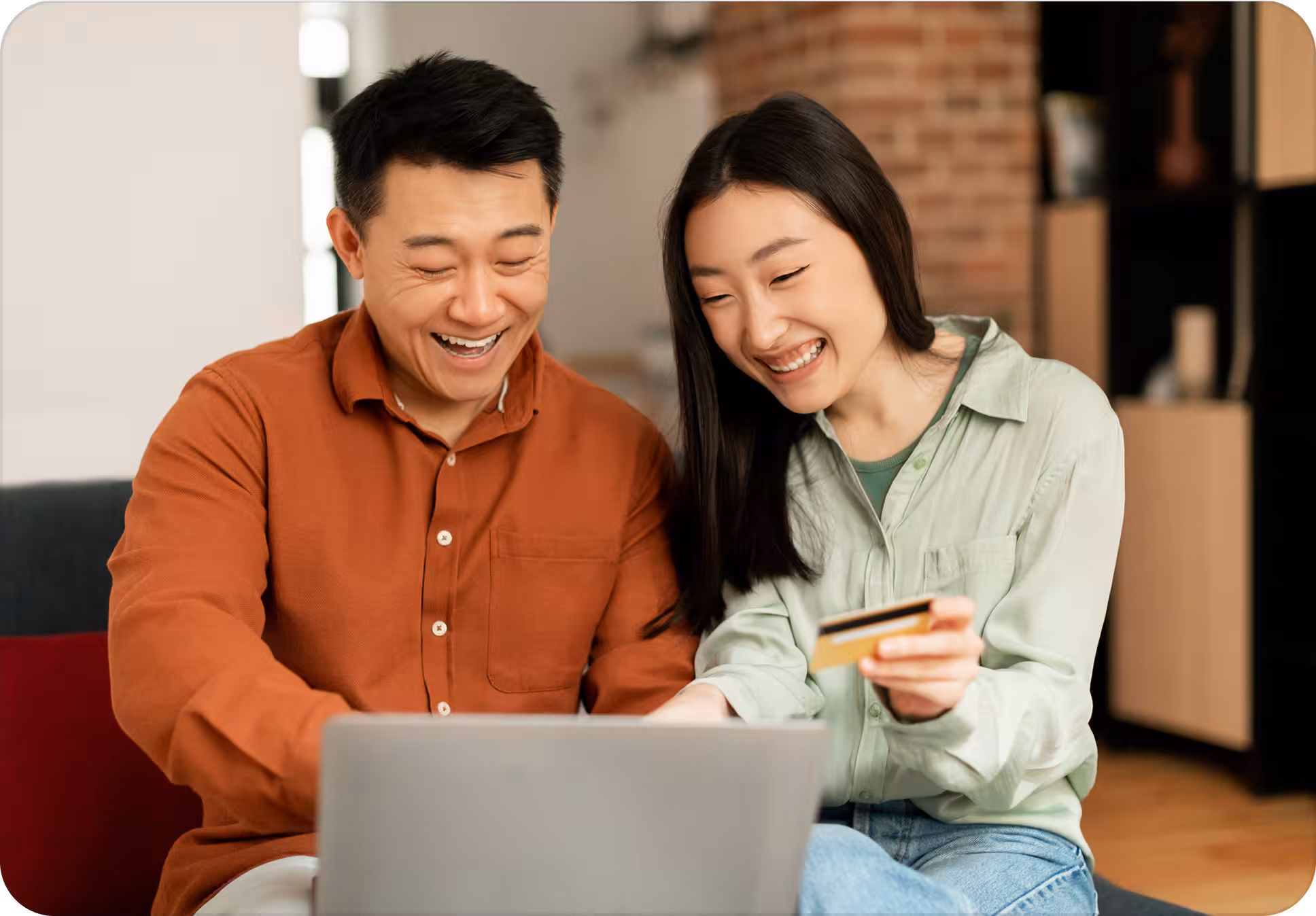 Couple comparing home loan packages on a laptop