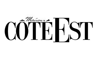Logo du magazine Maison Côté Est avec un texte en majuscules noires sur fond blanc.