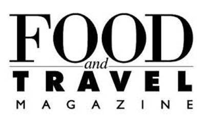 Logo en noir et blanc de Food and Travel Magazine avec le mot FOOD en majuscules serif, une ligne séparatrice, puis TRAVEL en majuscules gras sans serif, et MAGAZINE en petites majuscules sous le tout.