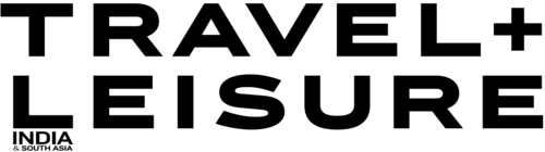 Logo de Travel + Leisure India avec le texte en lettres majuscules noires sur fond transparent.