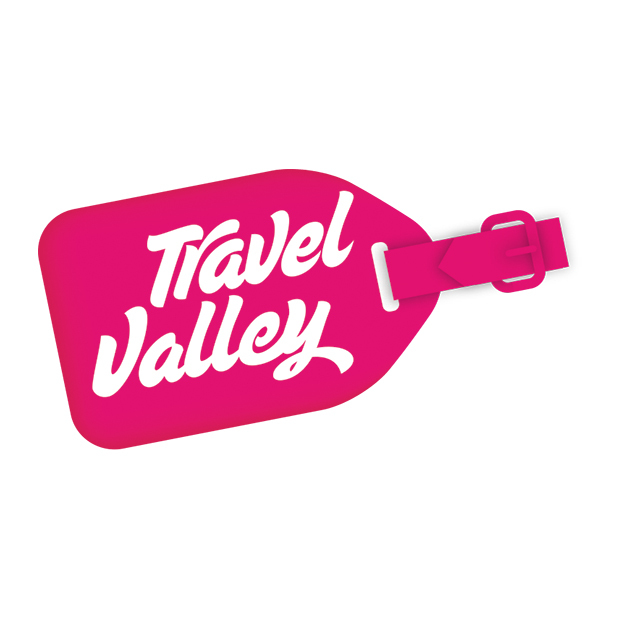 Étiquette de bagage rose vif avec la mention blanche « Travel Valley » en lettres cursives.