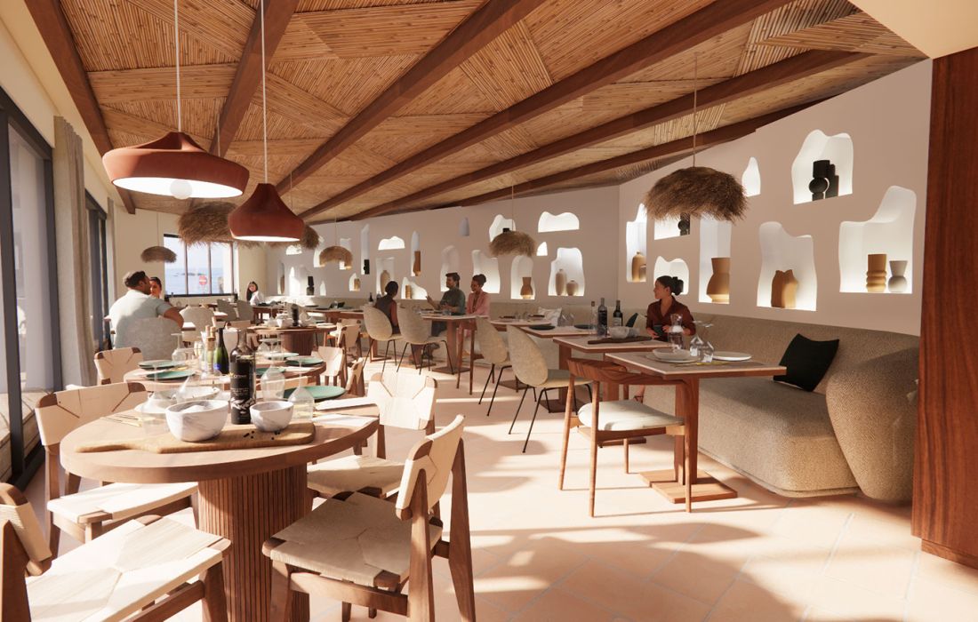 Intérieur d'un restaurant lumineux avec une décoration moderne en bois et beige, des suspensions en tissu et des niches intégrées dans les murs contenant des objets décoratifs, plusieurs personnes sont assises aux tables en train de manger et discuter.