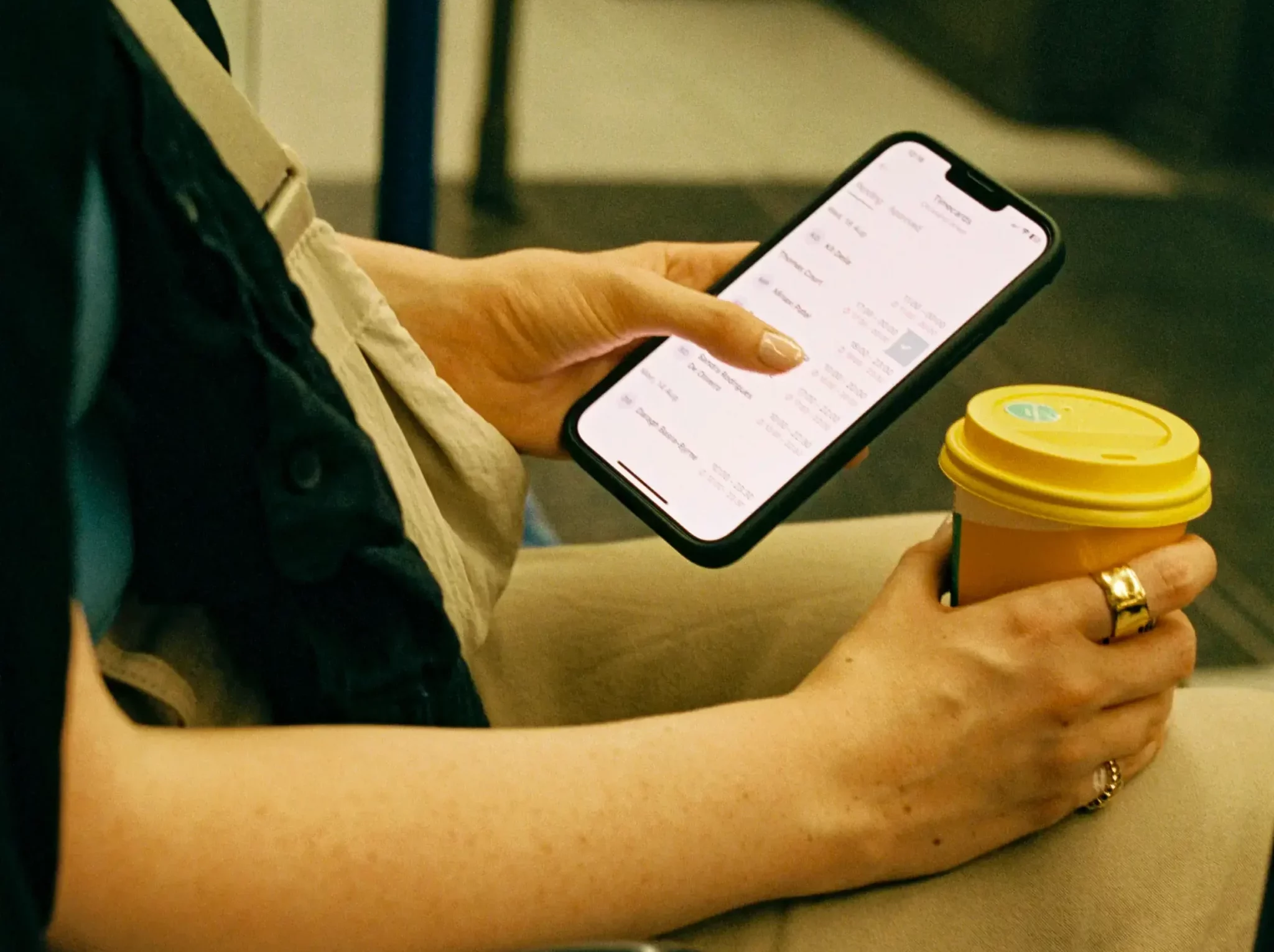 Person using phone on the train