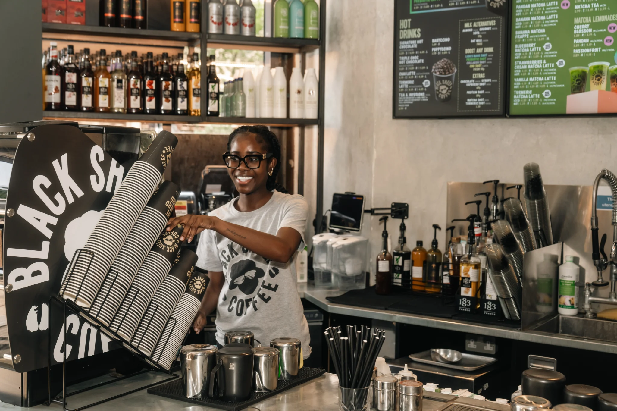 Cafe employee serving a customer
