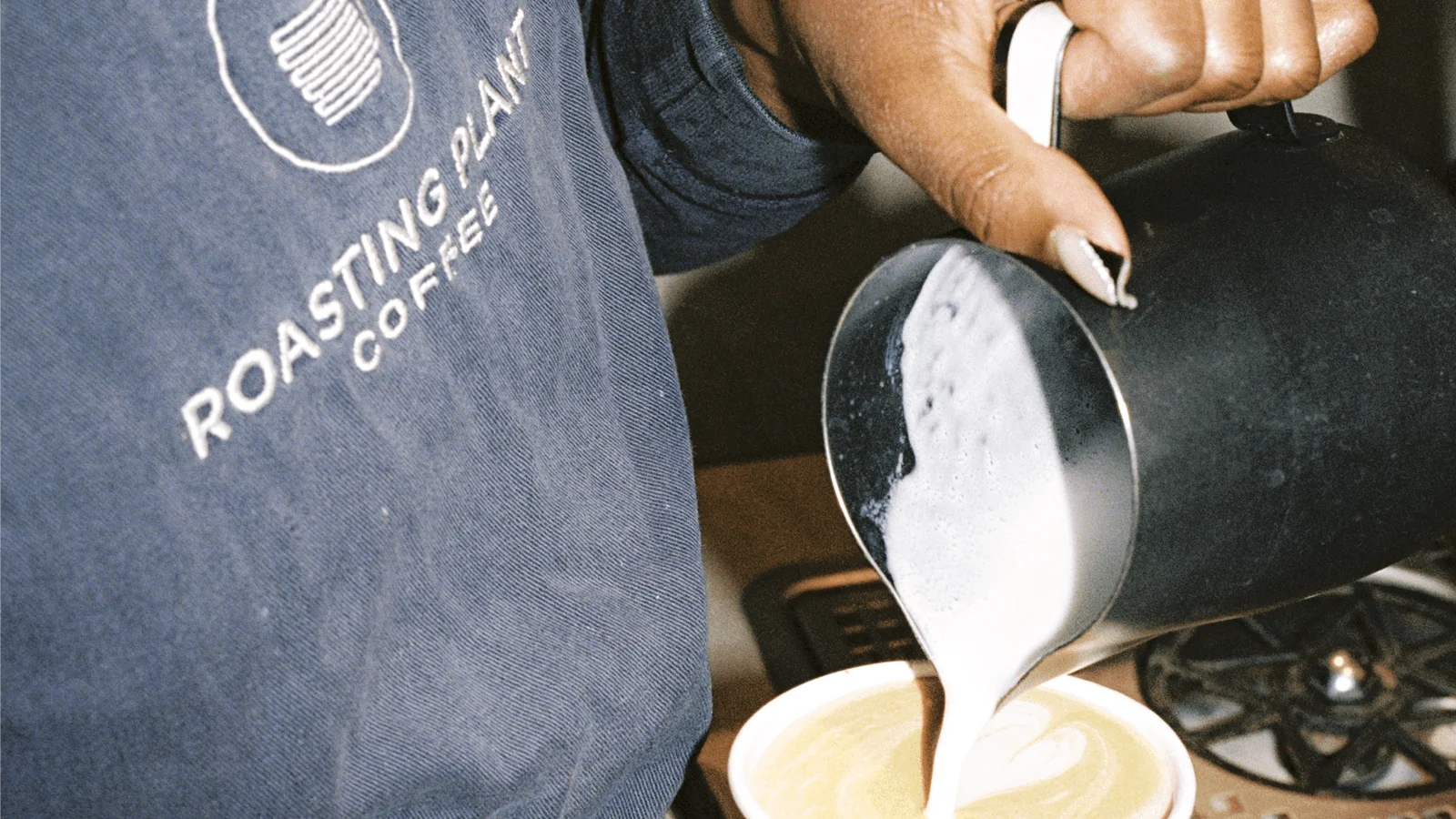 Roasting Plant Coffee barista serving coffee