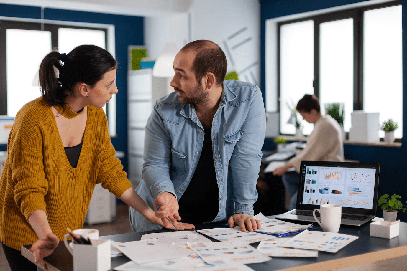 man and women discussing in an office