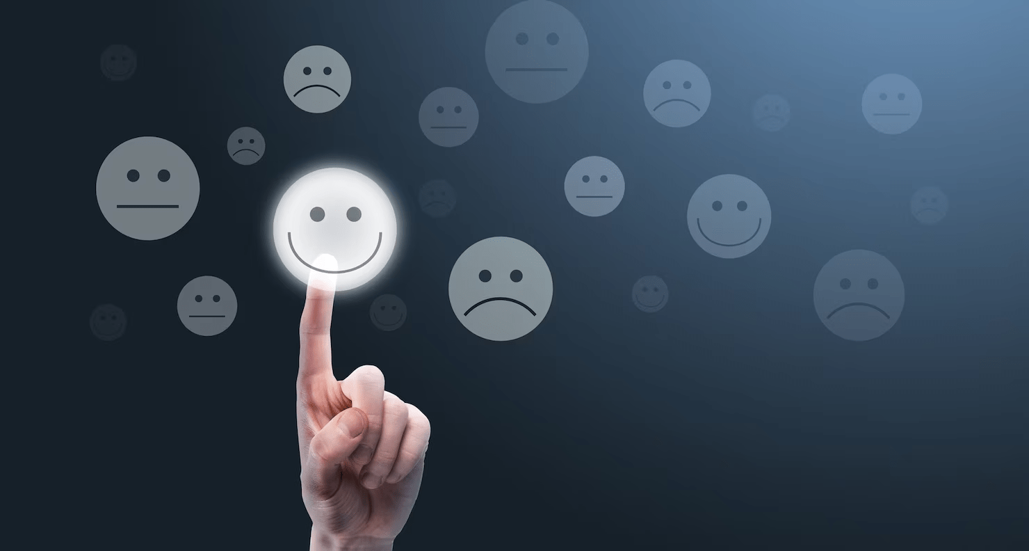 finger pointing at a smiling emoji