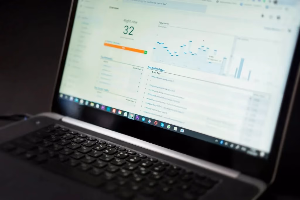 Laptop displaying ecommerce analytics and website traffic performance dashboard.