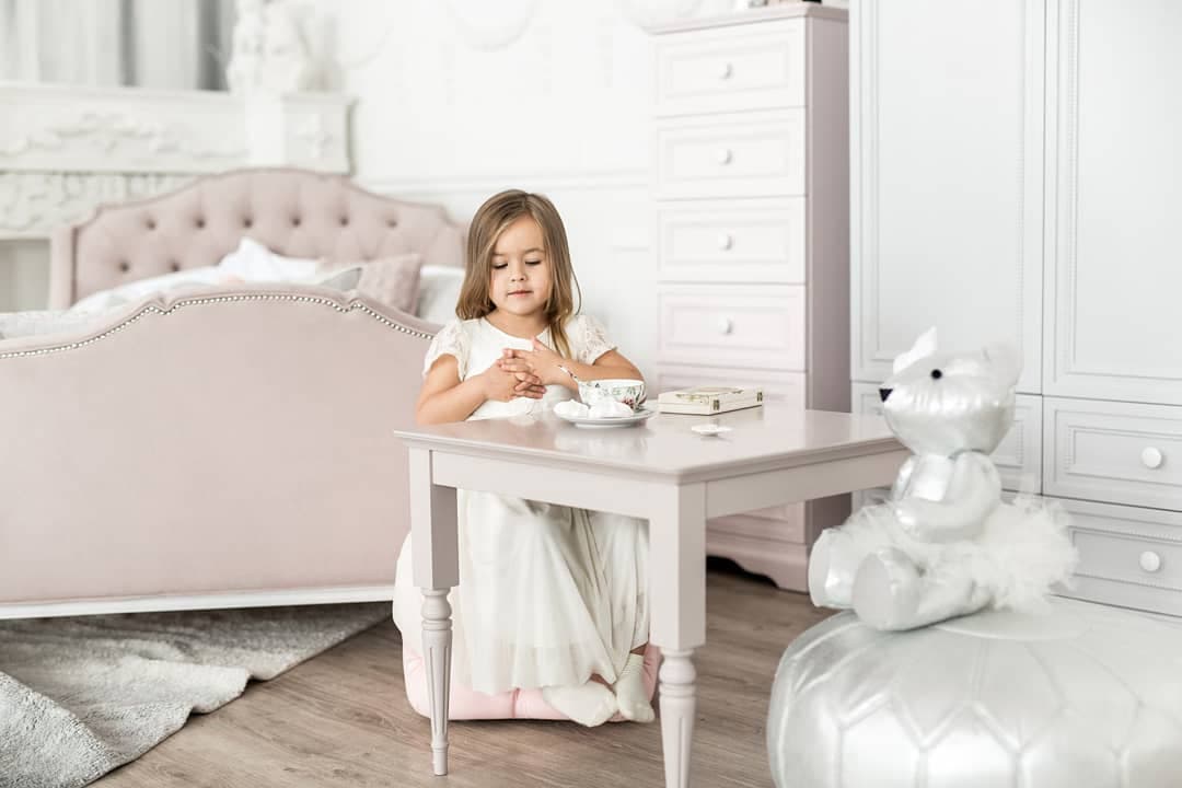 girl at the table in the nursery