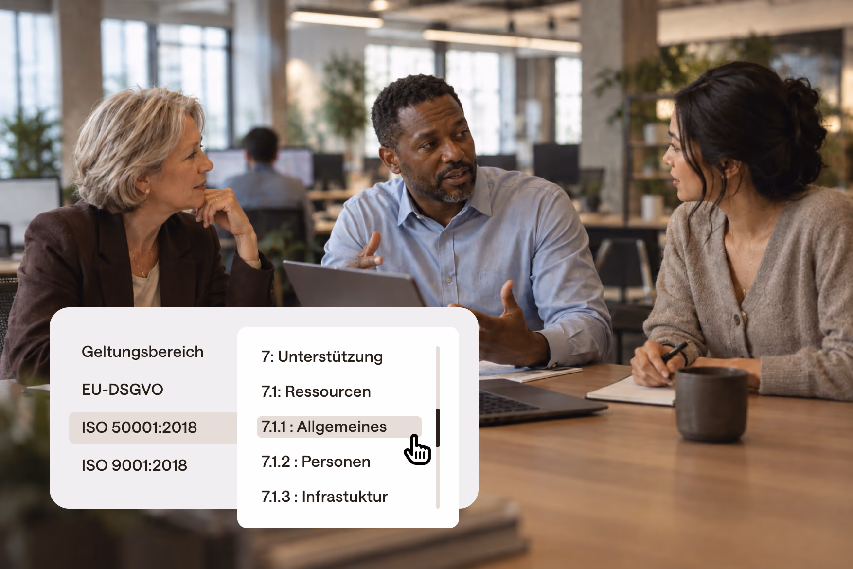 Three people in a modern office discussing standard mappings