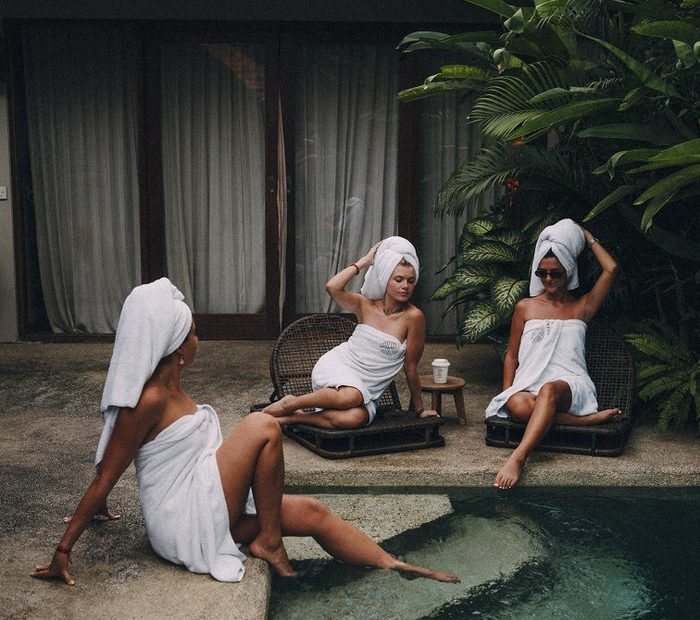 Guests relaxing at a garden spa