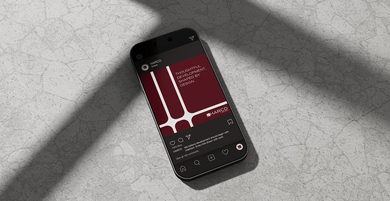 The Harco Partners app on a phone resting on marble