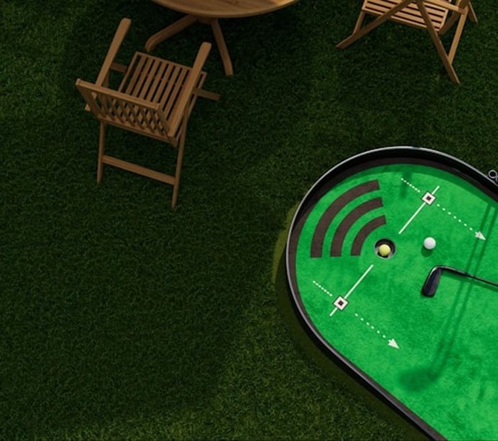 A putting green with lounge chairs