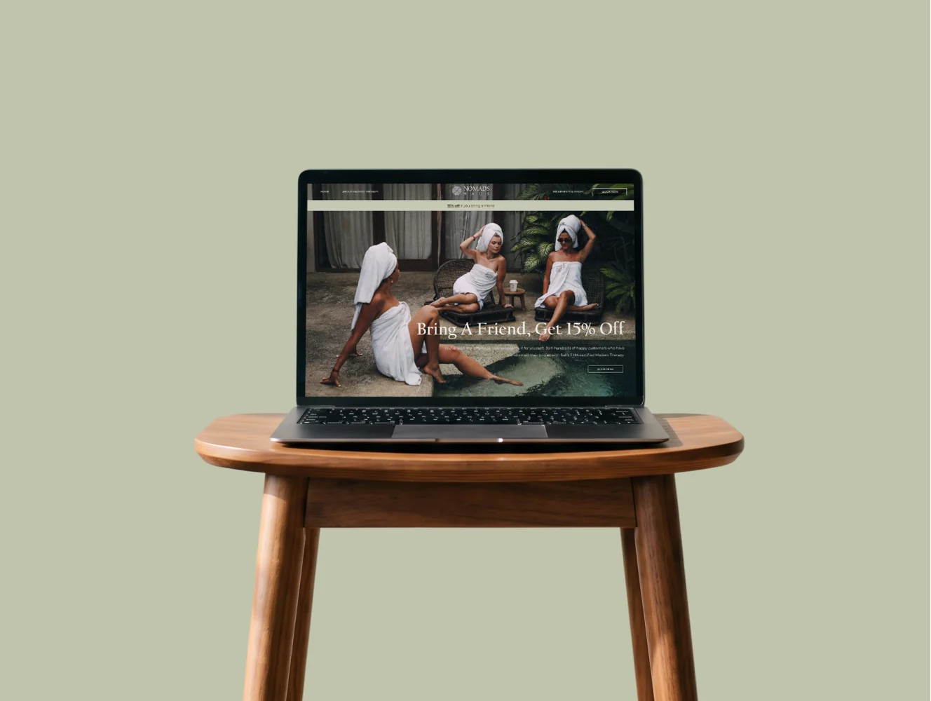 The Nomads Haus website shown on a laptop