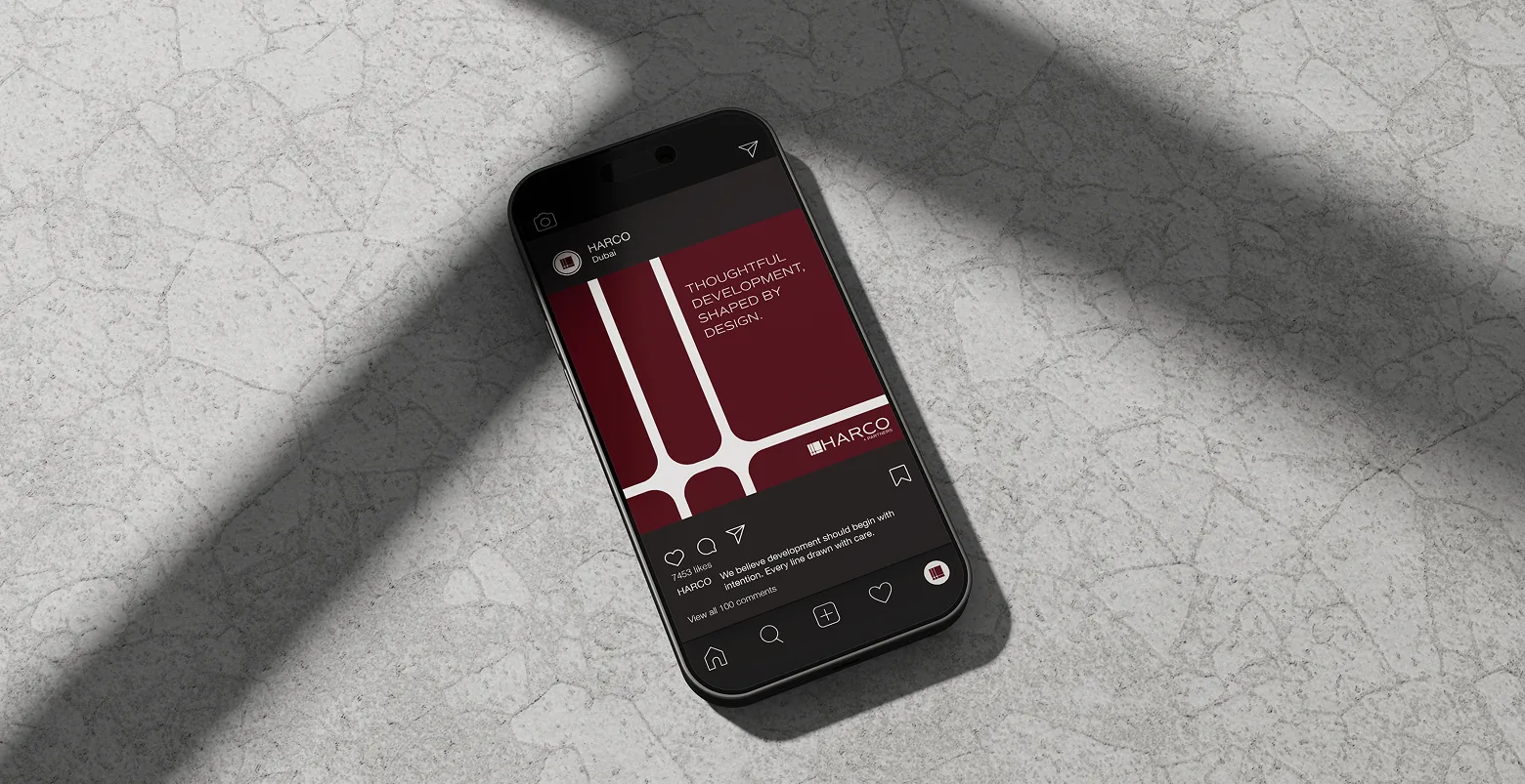 The Harco Partners app on a phone resting on marble