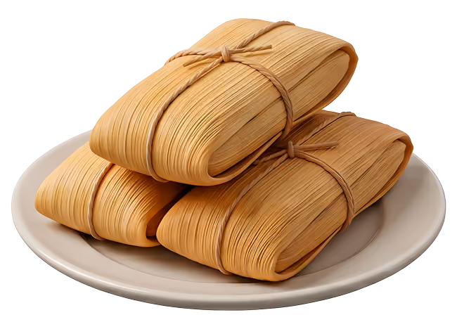 Three rectangular tamales wrapped in corn husks tied with strips on a beige plate.
