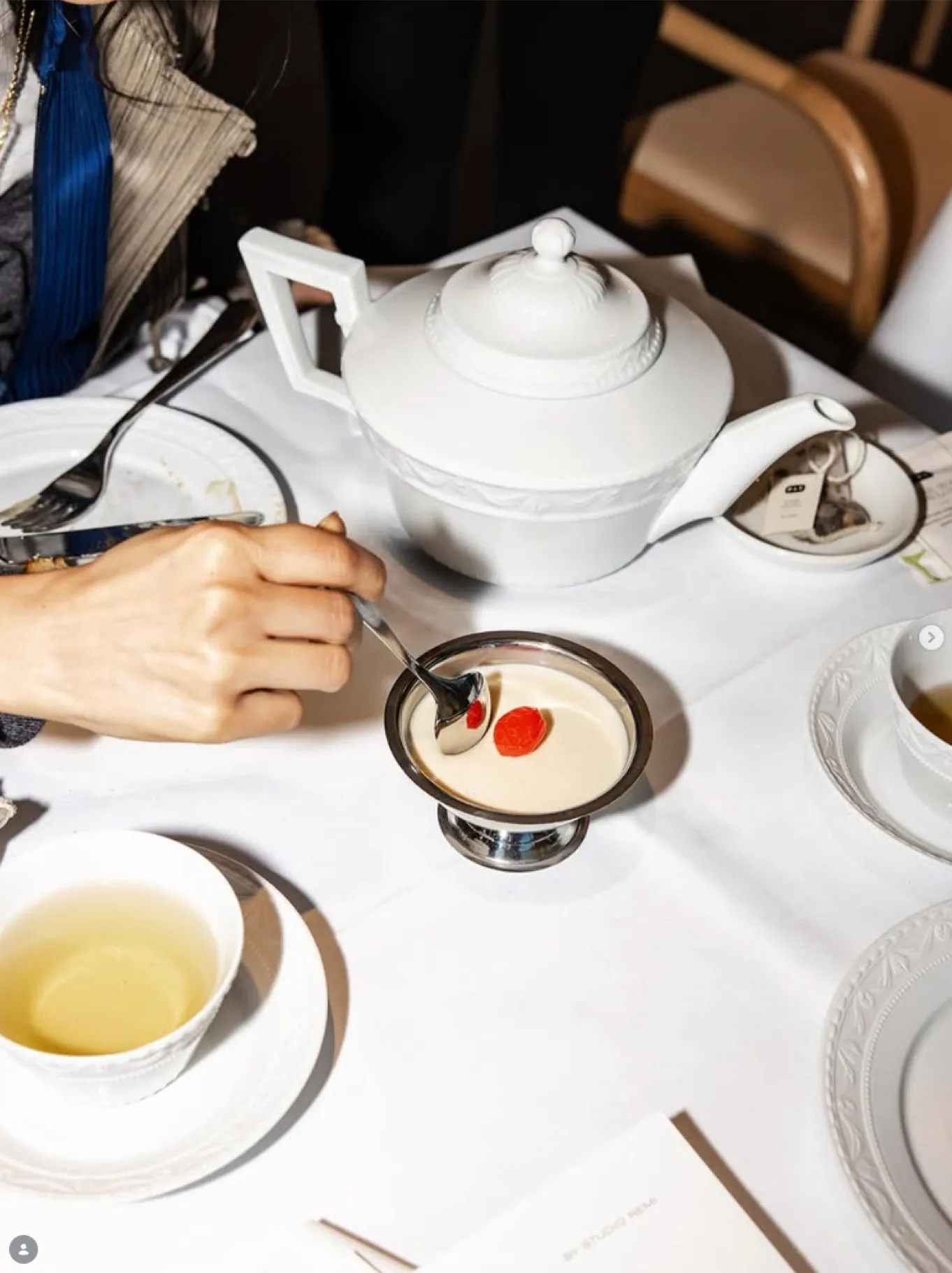 Tea served at a table set with white linen