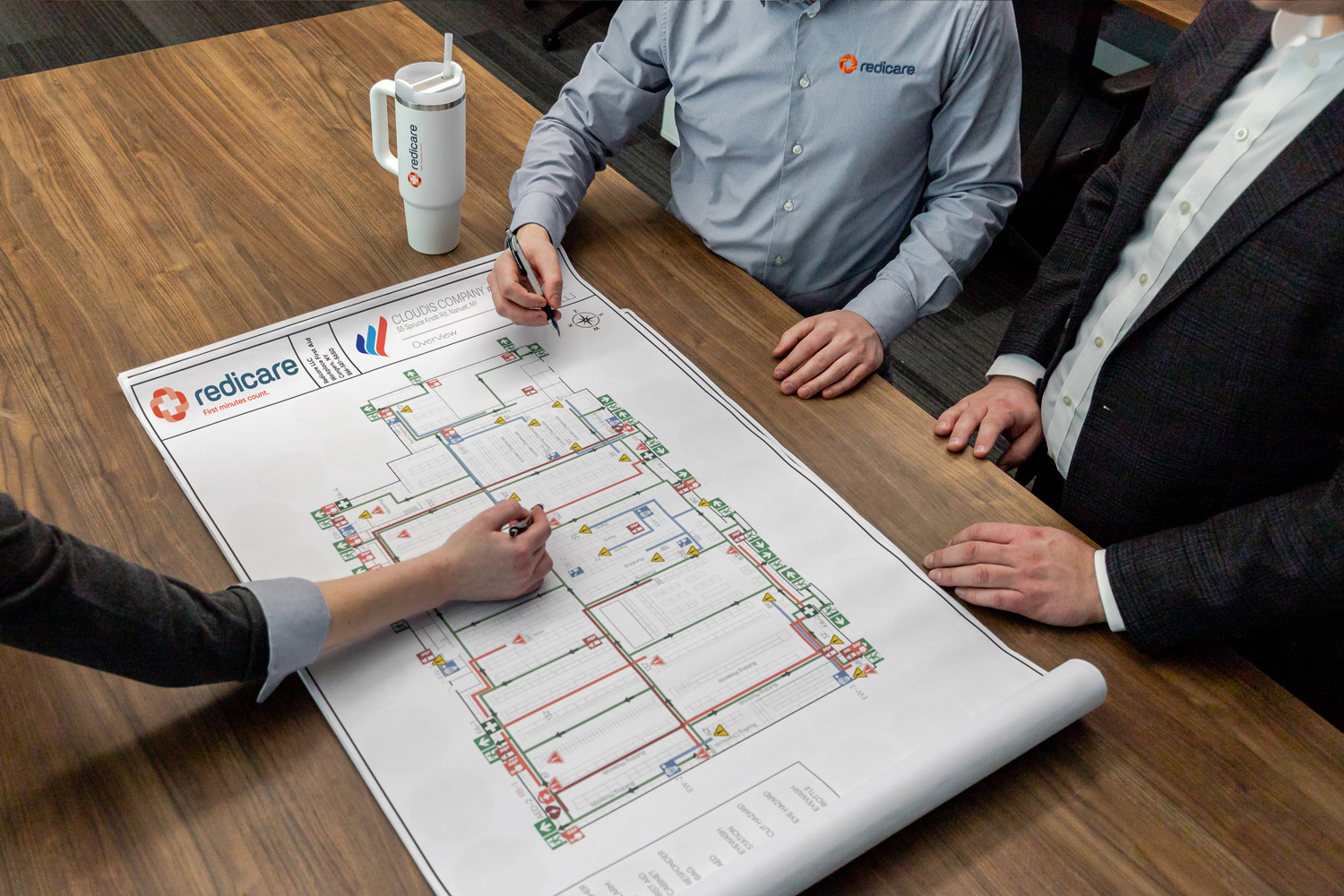 A Redicare representative planning first aid equipment placement in a facility