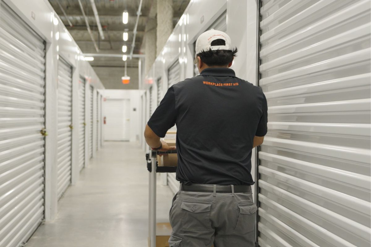 A Redicare representative at a storage area of first aid supplies