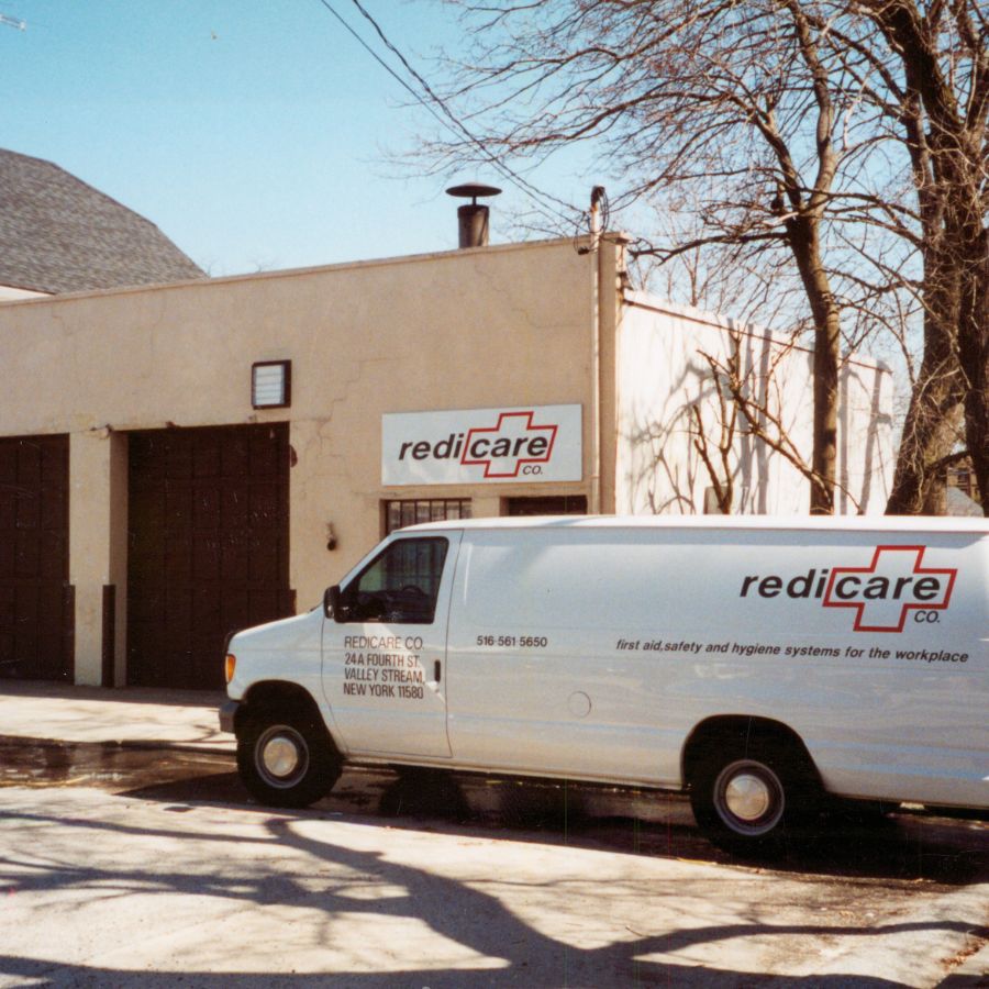 An old Redicare service van parked in front of one of the first locations.