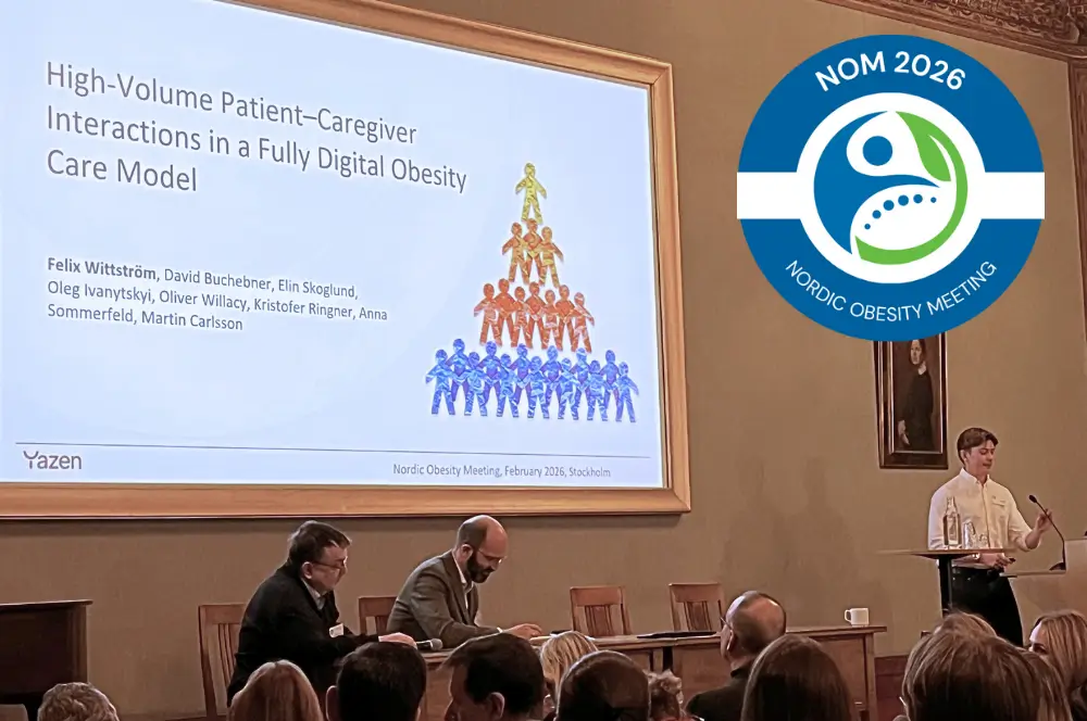Person presenting research on high-volume patient-caregiver interactions in a fully digital obesity care model at Nordic Obesity Meeting 2026, with audience and panelists visible.