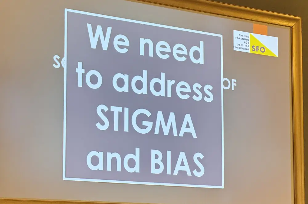 Slide with text We need to address STIGMA and BIAS in white letters on a purple background.