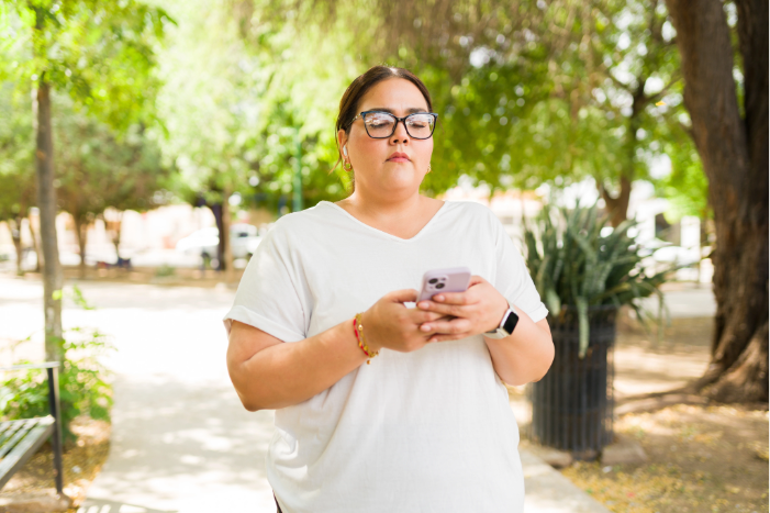A woman looking at her phone.